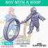 Boy with hoop and stick image