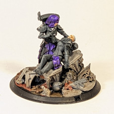 Picture of print of Warzone Nurse with wounded battle nun on diorama ornate base.