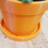 Flower pot with an integrative bottom and with drainage holes image