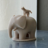 Elephant with a cat on its back image