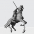 Medieval knight fighting from horseback with sword image