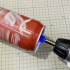 Electric drill accessory (fix the top part of a soda can) image
