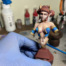 Picture of print of Femme Fatale Issue #001: Moxie the Brutale [ Female Tiefling Barbarian Pinup Miniature ]