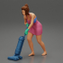 housewife makes home cleaning with a vacuum cleaner image