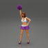 Young girl shaking pom poms image