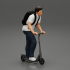 Man with backpack rolling on electric scooter image