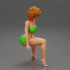 Young Woman Sitting in bikini with Curly Hair image