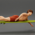 surfer man paddling laying on surfboard riding the wave image