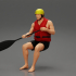 man in a raft boat paddling pose 1 image