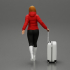 2 Fashion woman in jacket and boots dragging suitcase  walking in airport terminal image