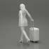 Business woman in manteau dragging suitcase  walking in airport terminal image