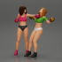 2 Girls Boxing in boxing gloves ready to finish off in the boxing ring about to be knocked out image