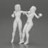 2 separated naked Girls Boxing in boxing gloves ready to finish off in the boxing ring about to be knocked out image