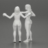 2 separated naked Girls Boxing in boxing gloves ready to finish off in the boxing ring about to be knocked out image