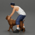 gangster homie in cap and short with his pitbull dog on the street image