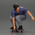 Man in hat riding sitting on skateboard image