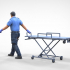 N1 Ambulance worker pulling wheeled stretcher or trolley image