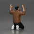 Asian gangster man in jacket sitting with his hands up ready to be arrested image